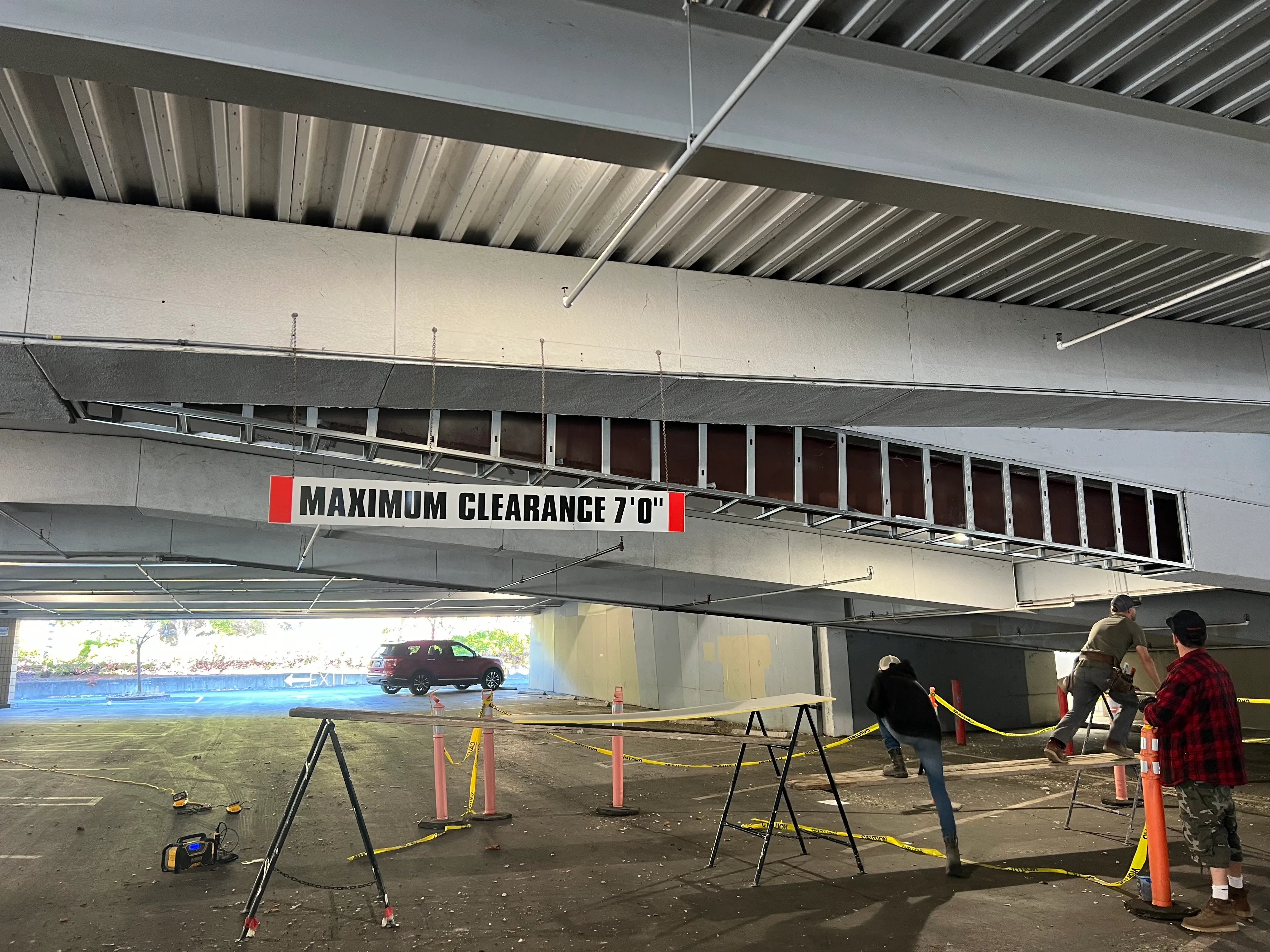 Metal stud framing on an overhead beam in the Northgate Mall parking structure (during)