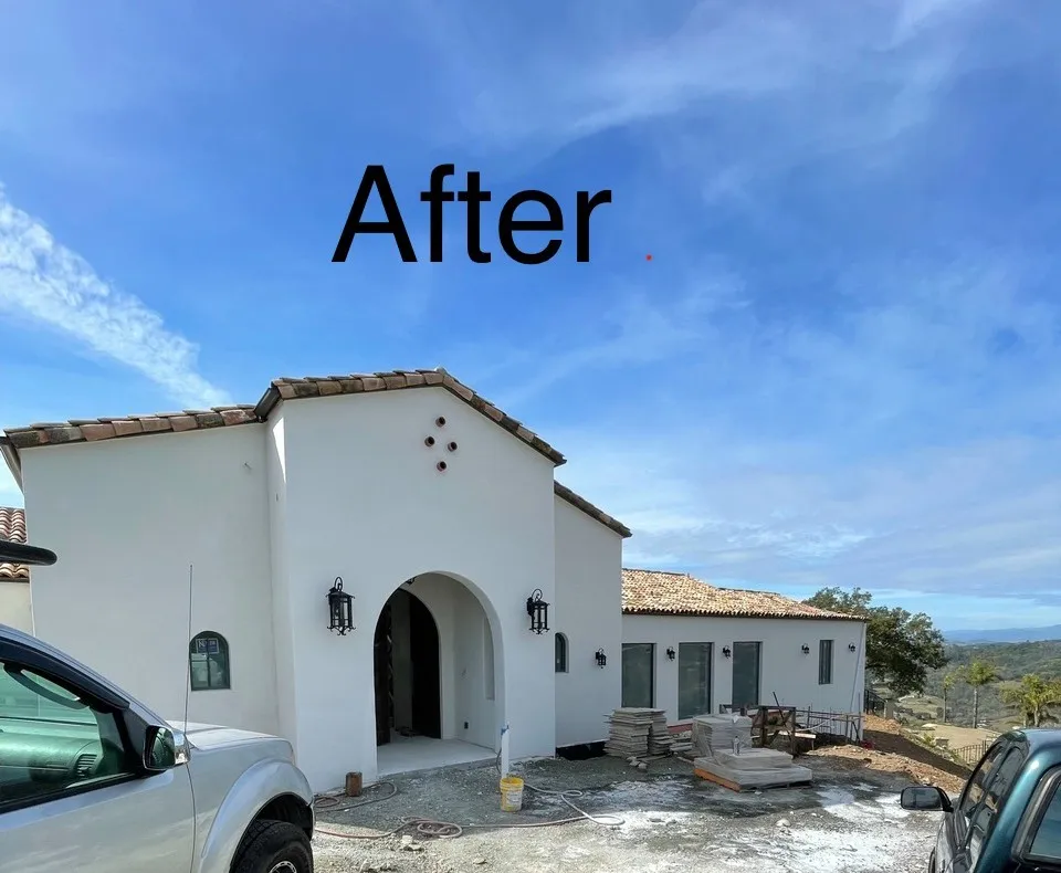 Completed Spanish-style home with white stucco exterior and clay tile roof (after) — exterior stucco in Santa Rosa